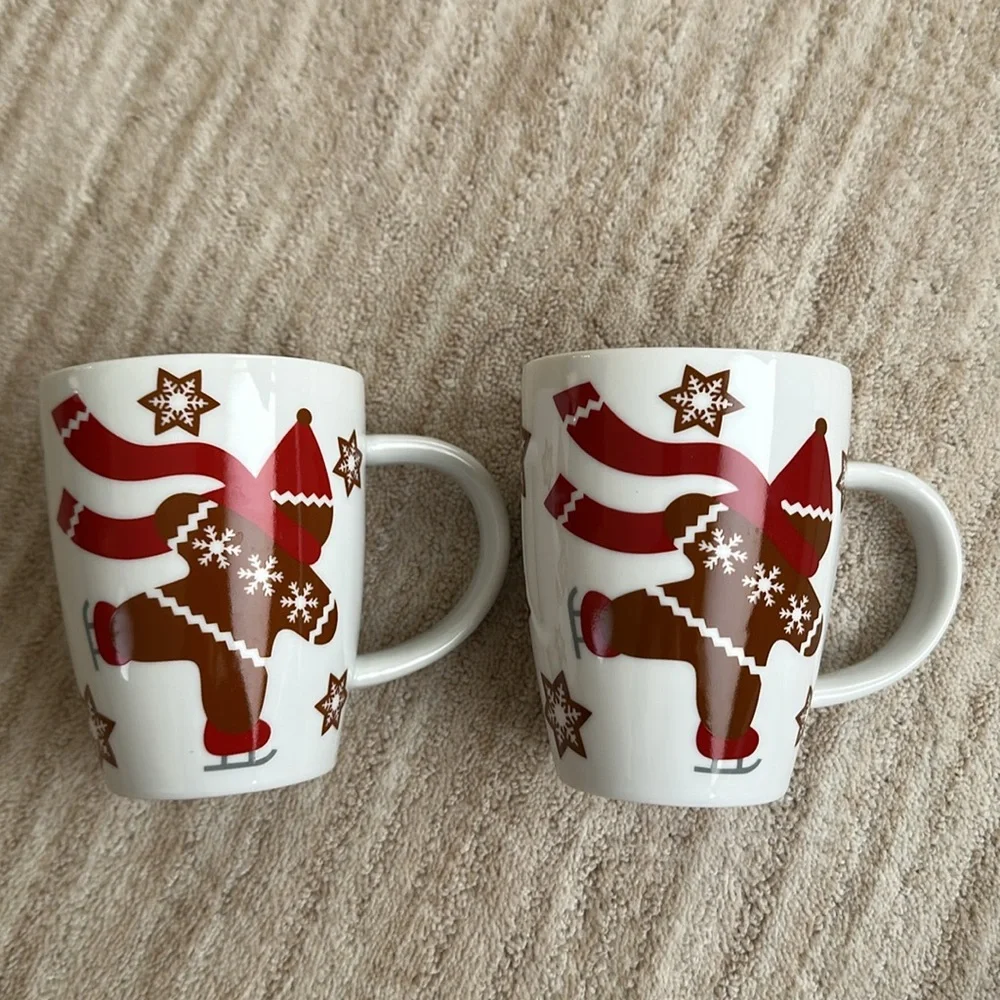 Set of 2 Crate & Barrel GINGERBREAD MAN Skating Snowflakes Coffee Cup Mug 4 1/2